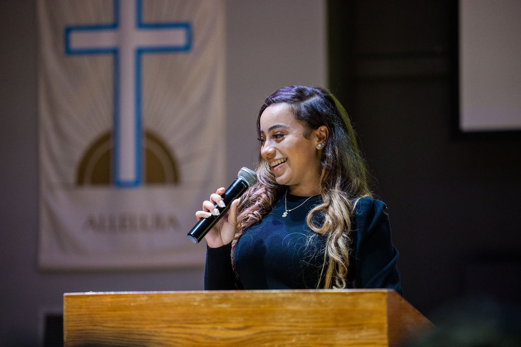 Student speaking in chapel